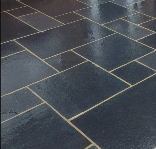 Black limestone paving slabs, deep charcoal finish for patios and outdoor spaces.