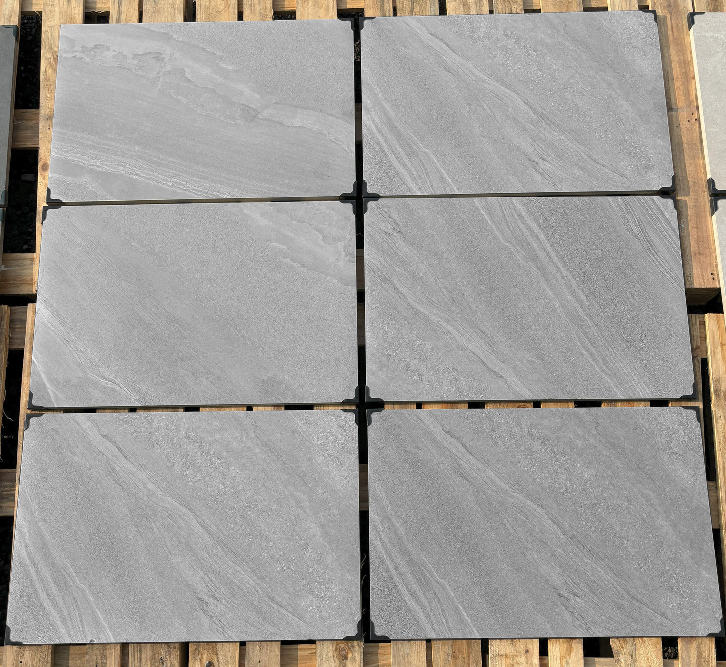 Porcelain patio slabs in Coventry Grey, durable outdoor tiles with a natural stone look.