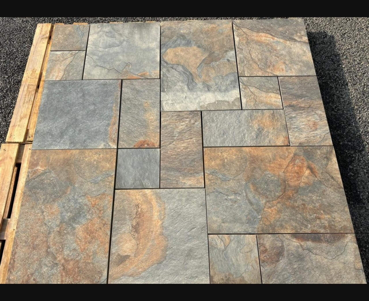 Porcelain paving in Exeter Bronze, textured metallic finish for modern garden patios.