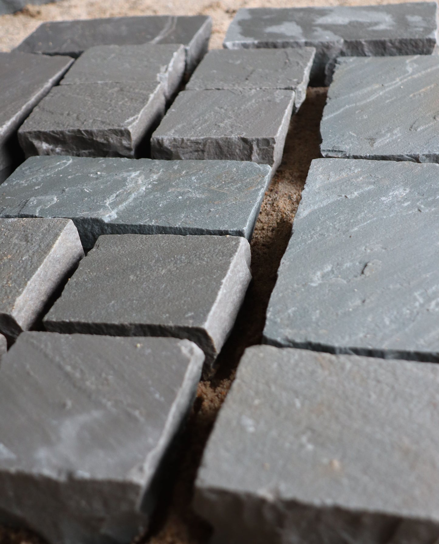 Grey Indian sandstone cobblestone pavers, Kandla Grey finish for outdoor paving.