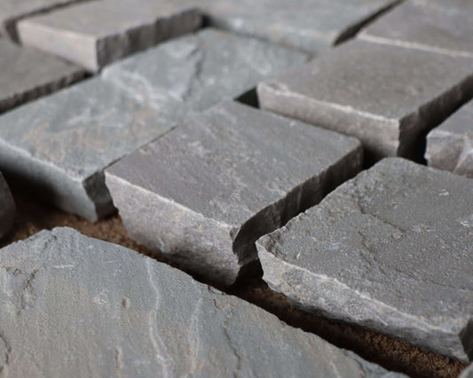 Kandla Grey sandstone cobblestones, hand cut setts for driveways and paths.