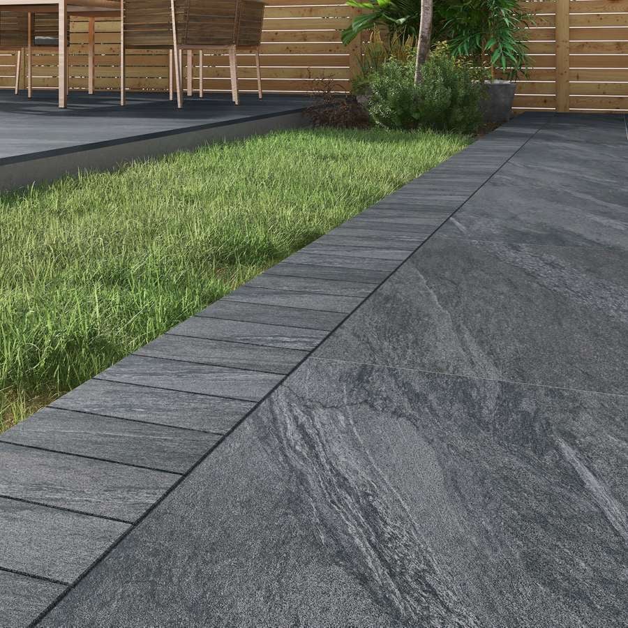 Manchester Midnight porcelain cobbles, dark edging setts for modern paving.