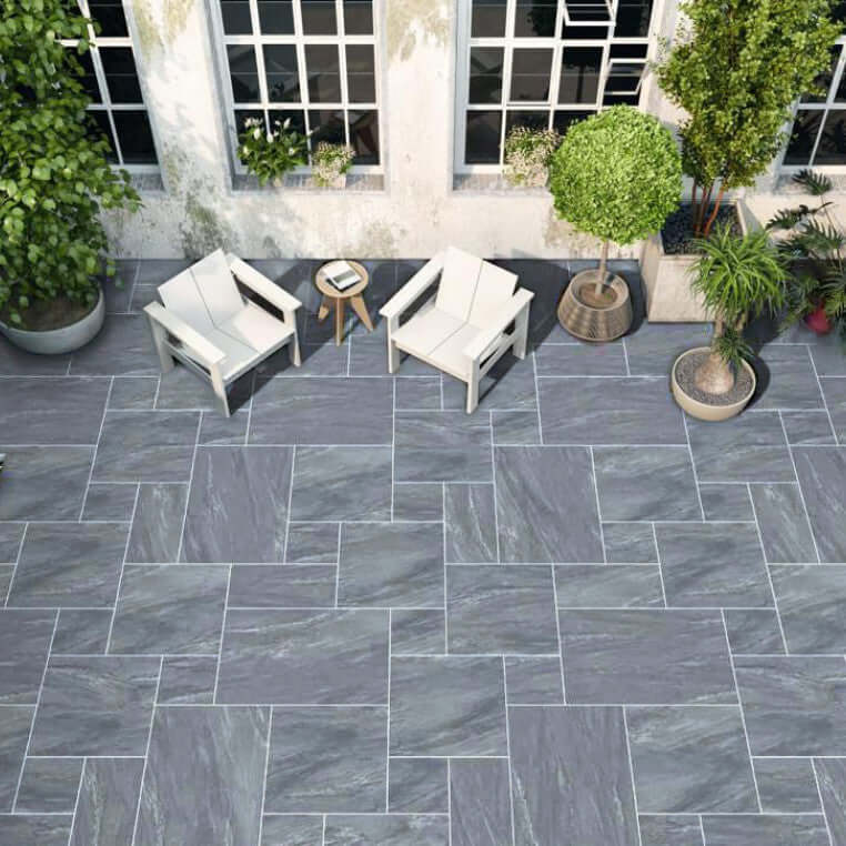 UK garden patio with Manchester Midnight porcelain slabs
