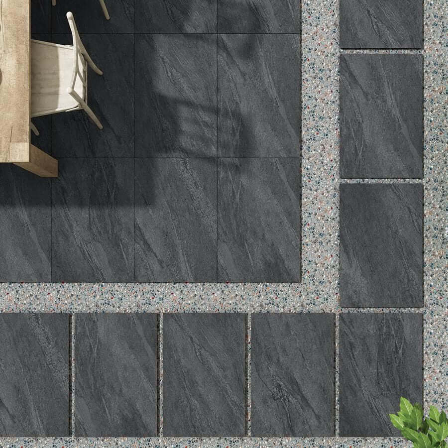 Manchester Midnight paving slabs, dark grey porcelain tiles for modern patios.