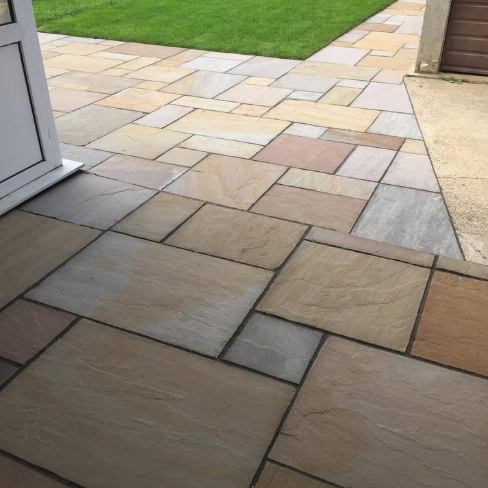 Natural Raj Green sandstone for patios, riven finish garden paving stones.