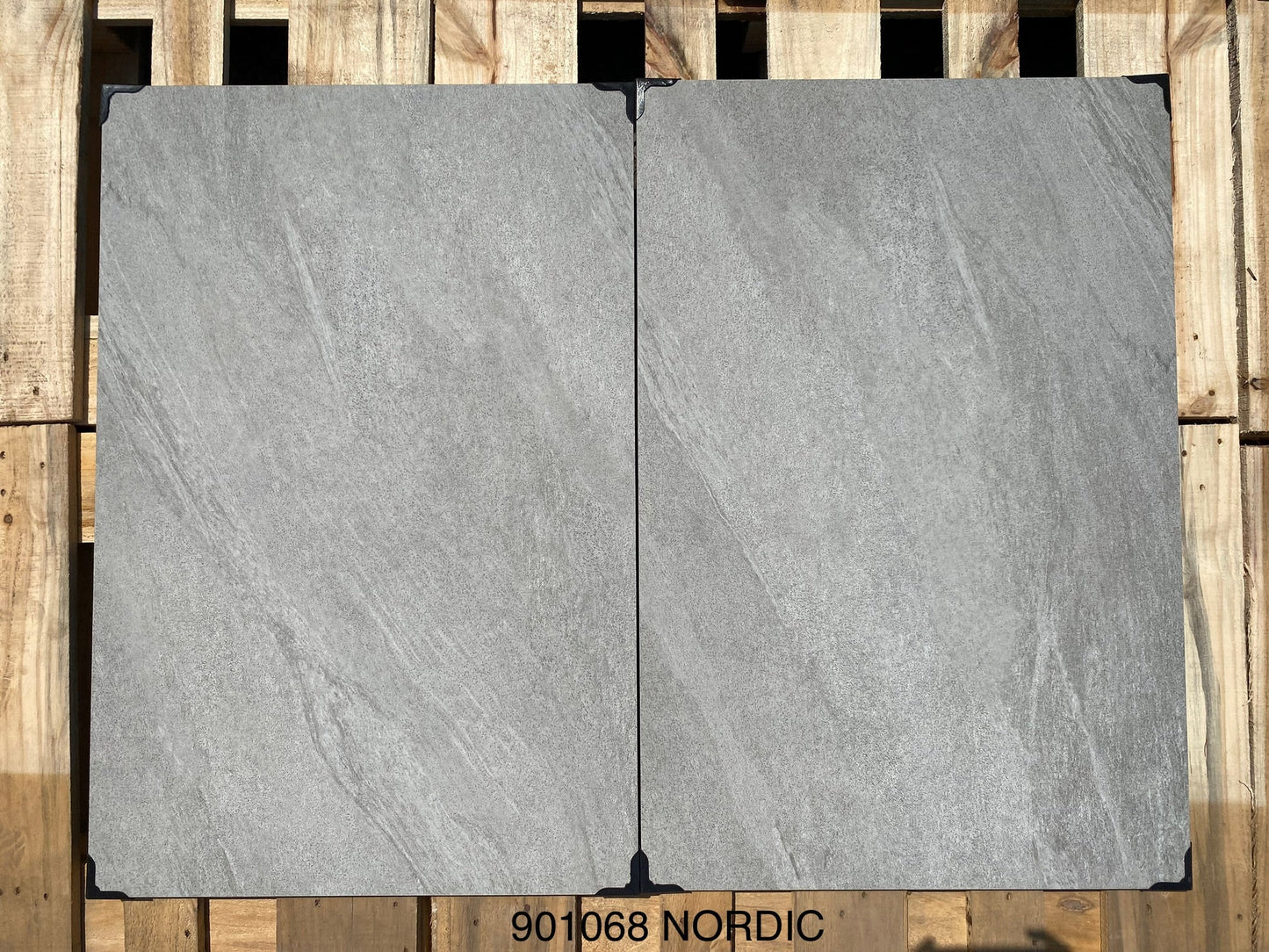Porcelain patio slabs in Shadow Grey, modern stone effect tiles for outdoor spaces.