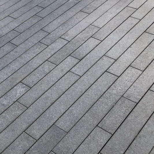Installing kerbstones and edging restraints for paving borders