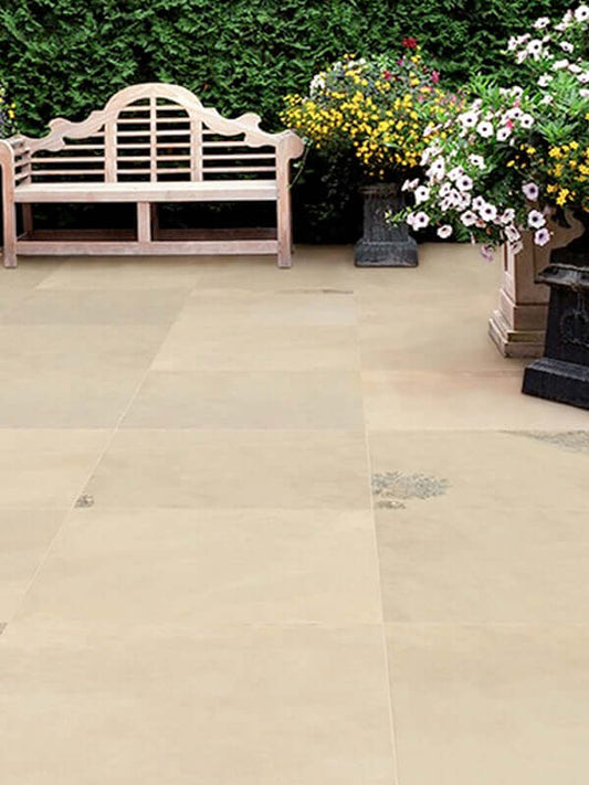 Combining irregular flagstones with climbing plants for a cottage garden patio