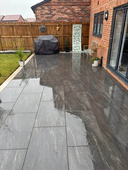 Anthracite Dark Porcelain paving Slabs installed in the outdoor garden in a house in the UK