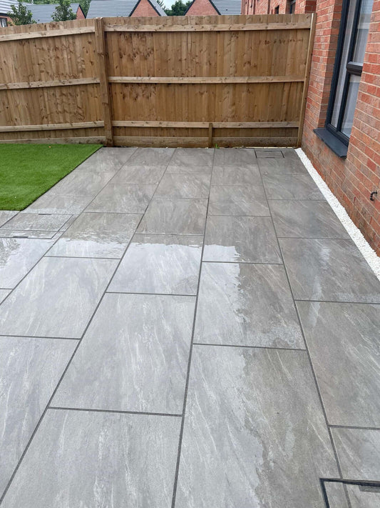 Outdoor patio finished with Anthracite Lite porcelain paving slabs