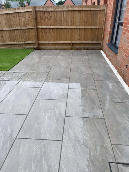 Anthracite Lite outdoor porcelain paving slabs finished on a garden patio terrace