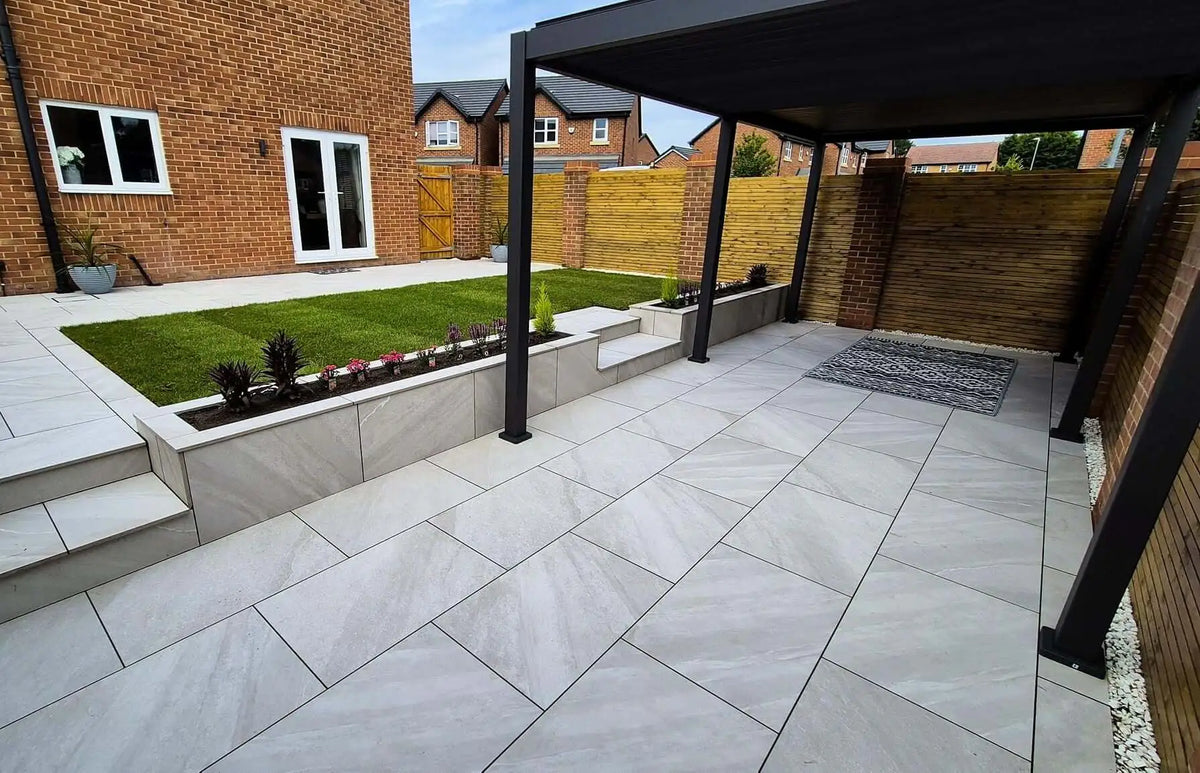 Dome Grey porcelain paving slabs installed in a modern UK home garden patio