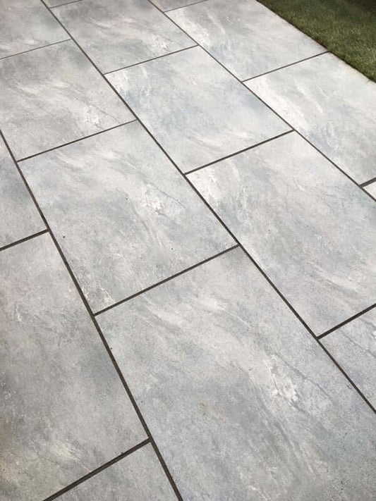 Residential patio design featuring EC Grey porcelain paving slabs