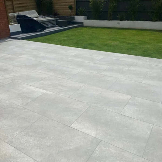 hs grey porcelain paving slabs layed in a beautiful garden in the uk