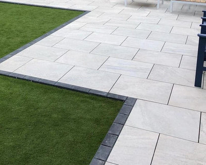 UK suburban patio featuring Kensington Pearl Garden Slabs