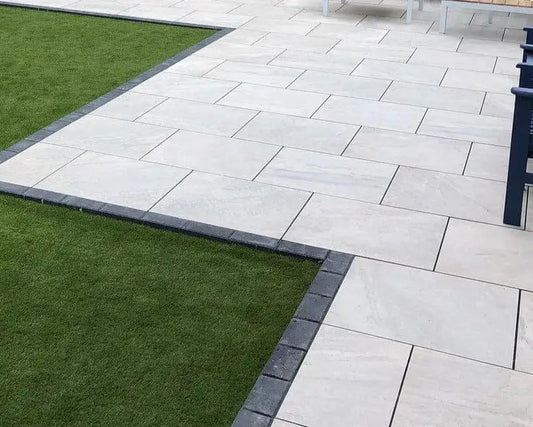 Kensington Pearl outdoor garden paving slabs laid in a UK suburban patio setting