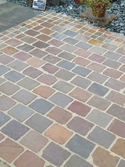 raj green cobblestone laying imaged in the driveway 