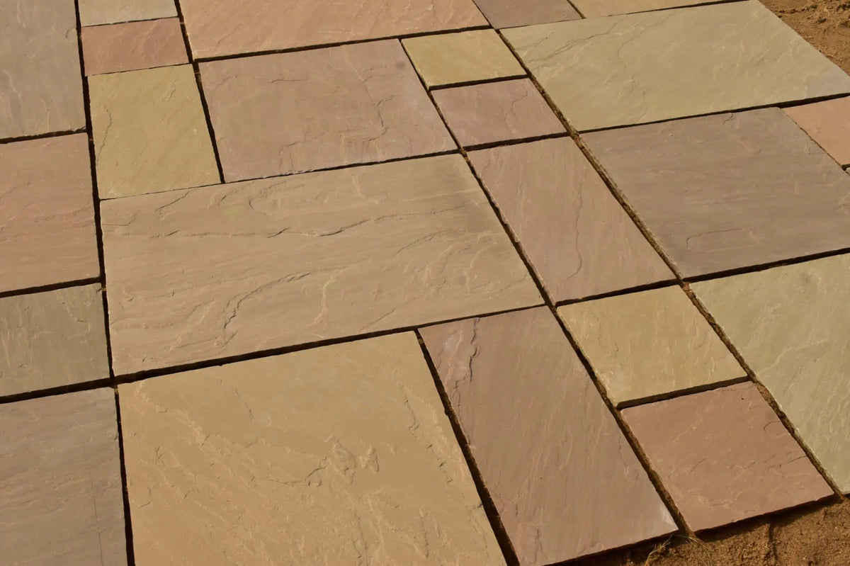 Raj Green Indian sandstone patio pack paving slabs laid in a garden