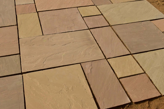 Raj Green Indian sandstone patio pack paving slabs laid in a garden