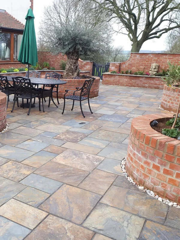 rustic slate paving slabs layed in a beautiful garden in the uk