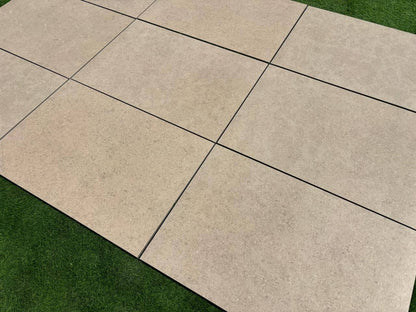 Close-up look of Sinai Pearl Porcelain Paving Slabs laid in the UK garden