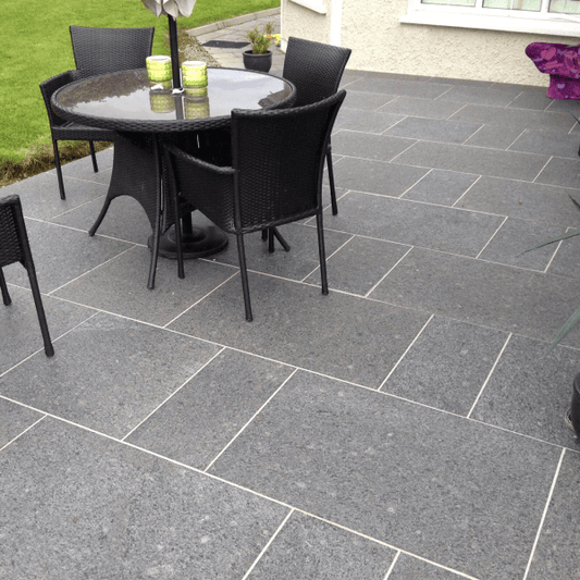 Black granite paving, featuring a flamed finish, this natural stone is ideal for modern patios and driveways.