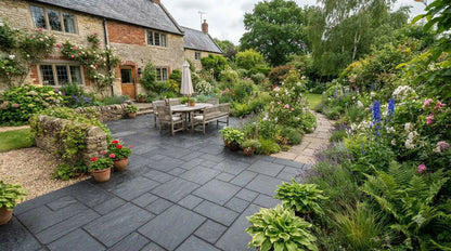 Black granite paving patio with outdoor dining set in a lush garden setting.