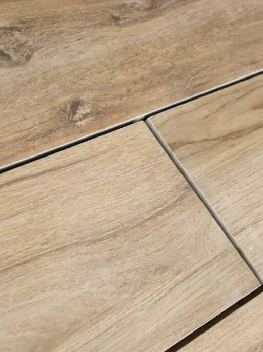 Natural brown wood effect porcelain paving planks close-up