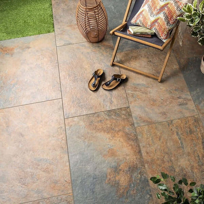 Outdoor seating area with Exeter Bronze porcelain paving slabs