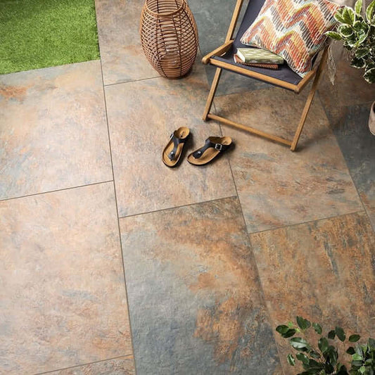 Outdoor seating area with Exeter Bronze porcelain paving slabs