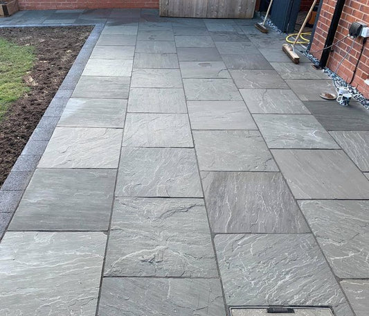 Kandla Grey Indian sandstone paving slabs, a natural riven finish for patios and gardens.