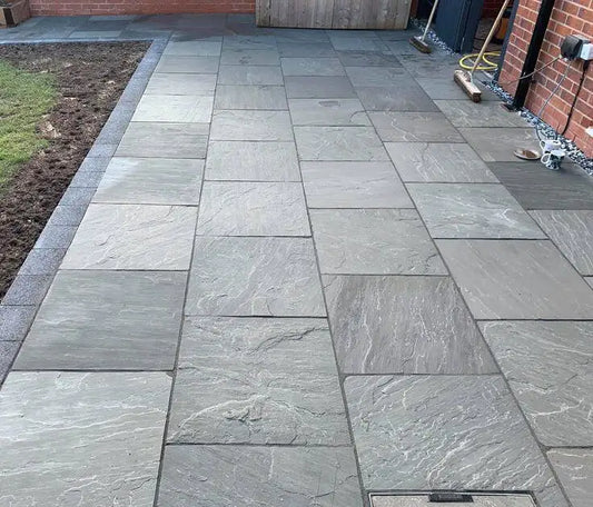 Kandla Grey Indian sandstone paving slabs, a natural riven finish for patios and gardens.