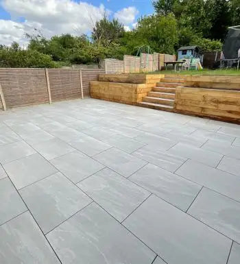 Kandla Grey porcelain paving slabs installed in a British home garden patio
