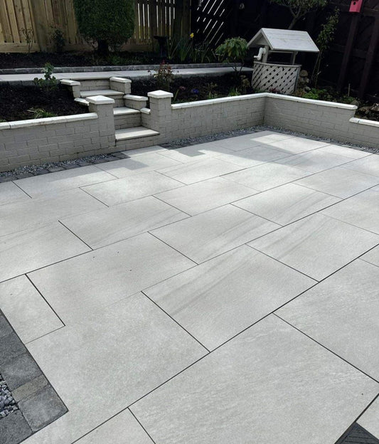 UK suburban patio featuring Kensington Pearl Porcelain Paving Slabs