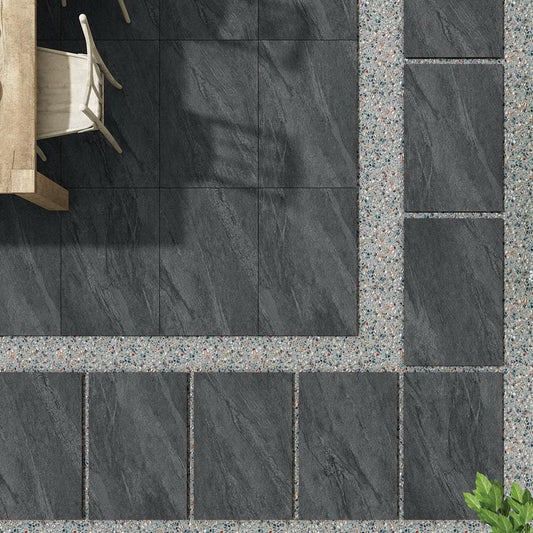 Manchester Midnight paving slabs, dark grey porcelain tiles for modern patios.