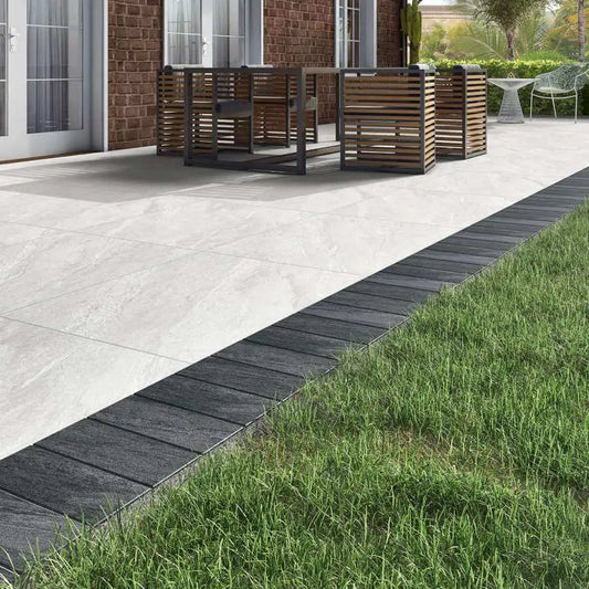 Porcelain cobbles in Midnight Grey, durable border stones for modern outdoor design.