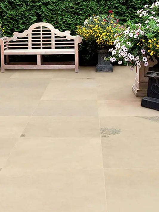 Mint Fossil effect porcelain paving slabs laid on a garden terrace
