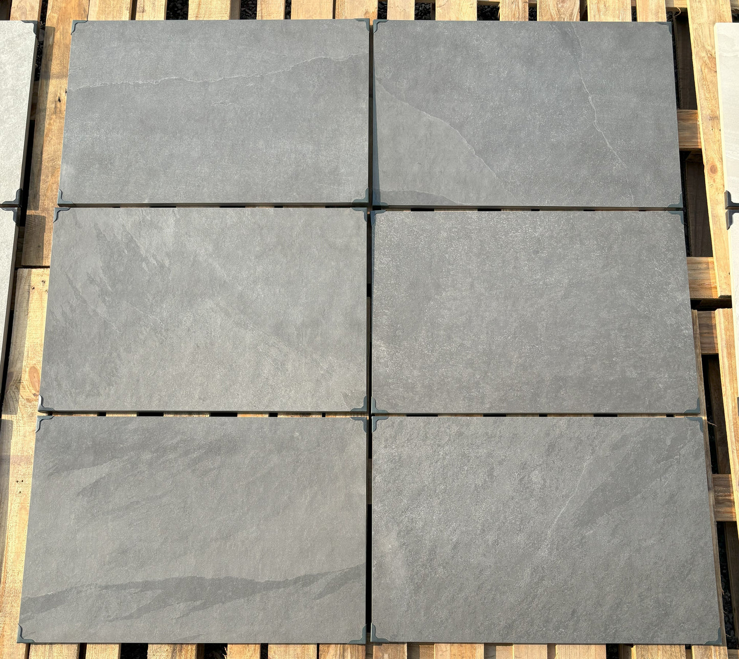 Newcastle Black patio slabs, durable black porcelain for contemporary landscaping.