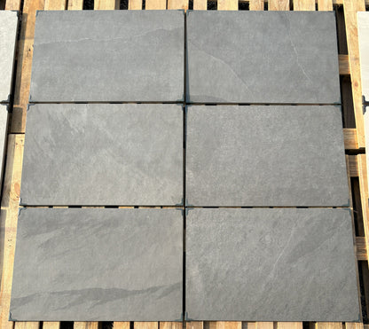 Newcastle Black patio slabs, durable black porcelain for contemporary landscaping.