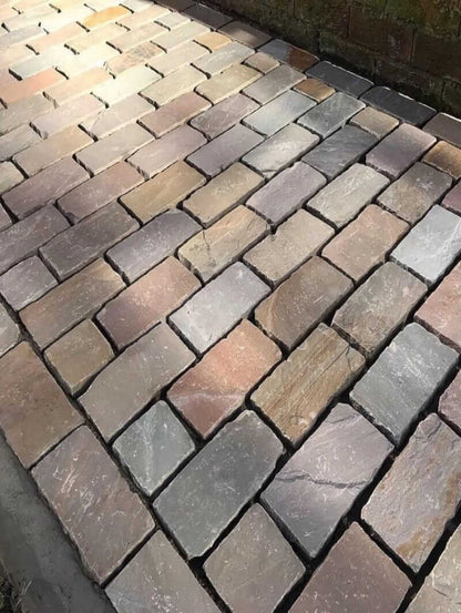 raj green cobblestones natural split surface laying image in the uk garden