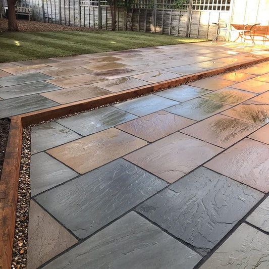 Raj Green Indian sandstone paving slabs, natural mix of green and brown tones.