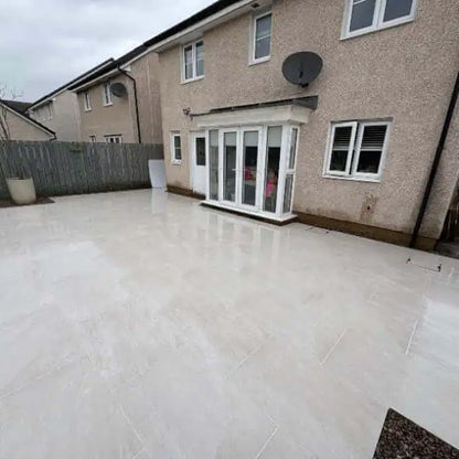 Rasa White porcelain paving slabs 600x900 mm laid in a Leeds UK garden