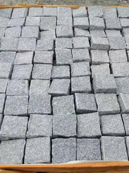 Silver grey granite handcut cobbles and rustic pathway paving UK