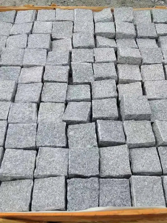 Silver grey granite handcut cobbles and rustic pathway paving UK
