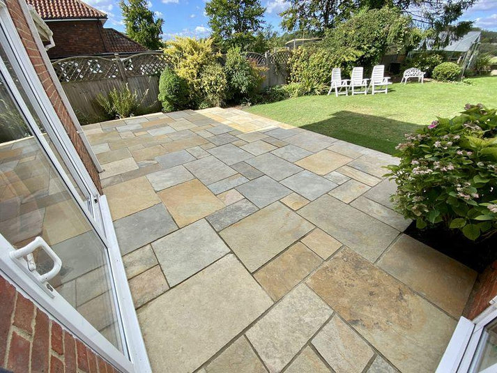Tandur Yellow Limestone paving slabs, natural riven finish, warm golden tone.