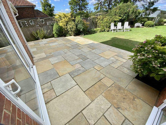 Tandur Yellow Limestone paving slabs, natural riven finish, warm golden tone.
