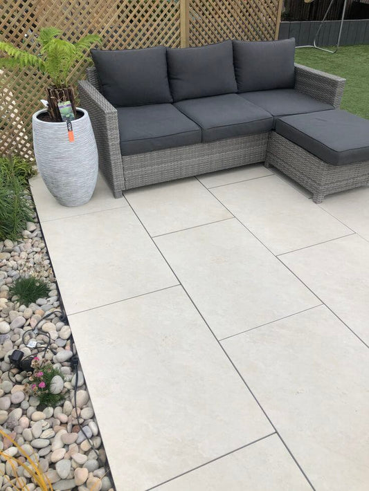 Windsor Quartz Porcelain garden slabs installation in a landscaped garden UK