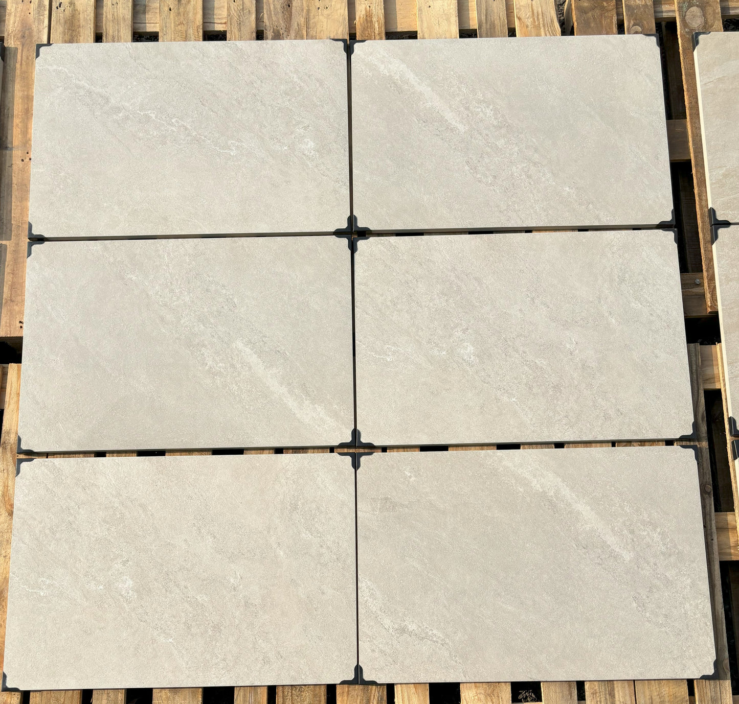 Yorkstone White patio slabs, natural stone effect porcelain for elegant landscaping.