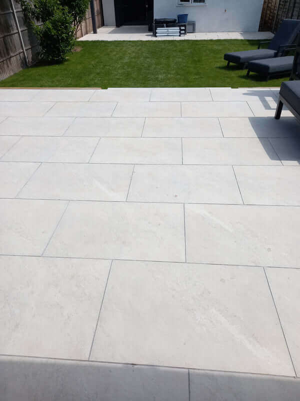 Contemporary UK patio design with Yorkstone White Porcelain Garden Slabs